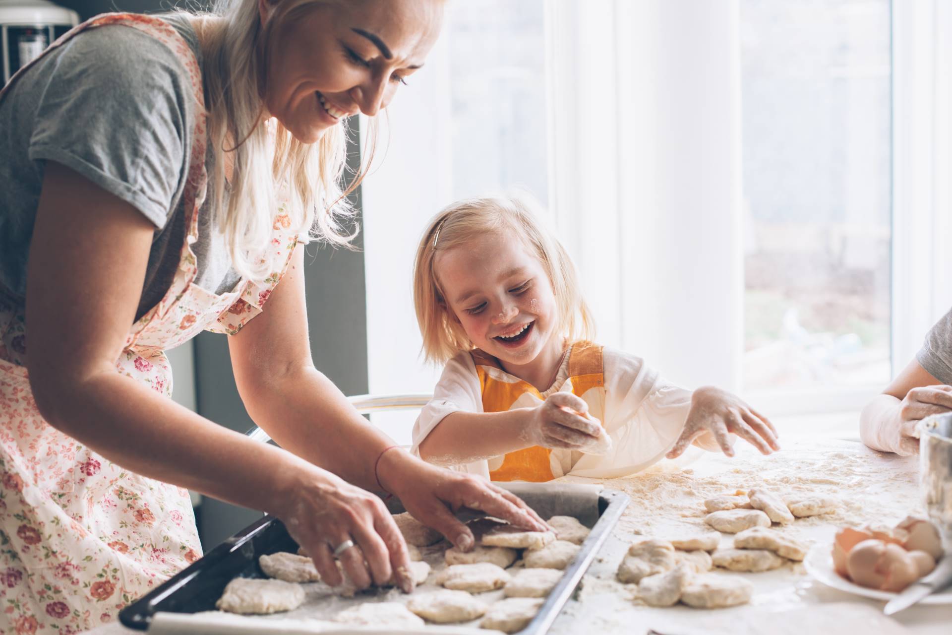 Mom cooking with daughter on the kitchen